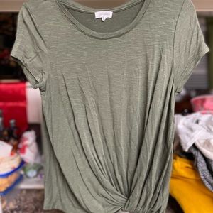 T-shirt with a little tie knot it the bottom